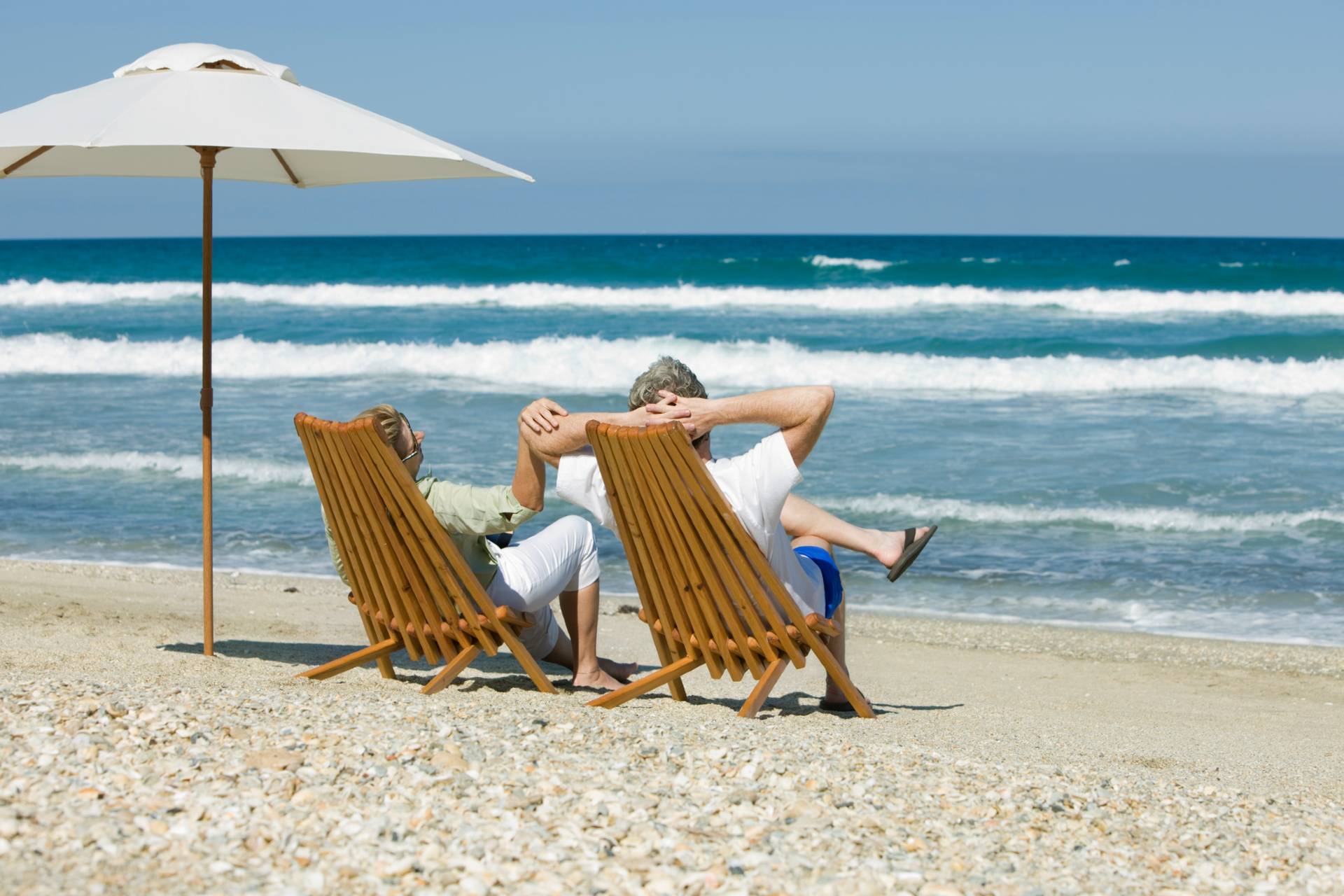 seniors relaxing on the beach in Florida