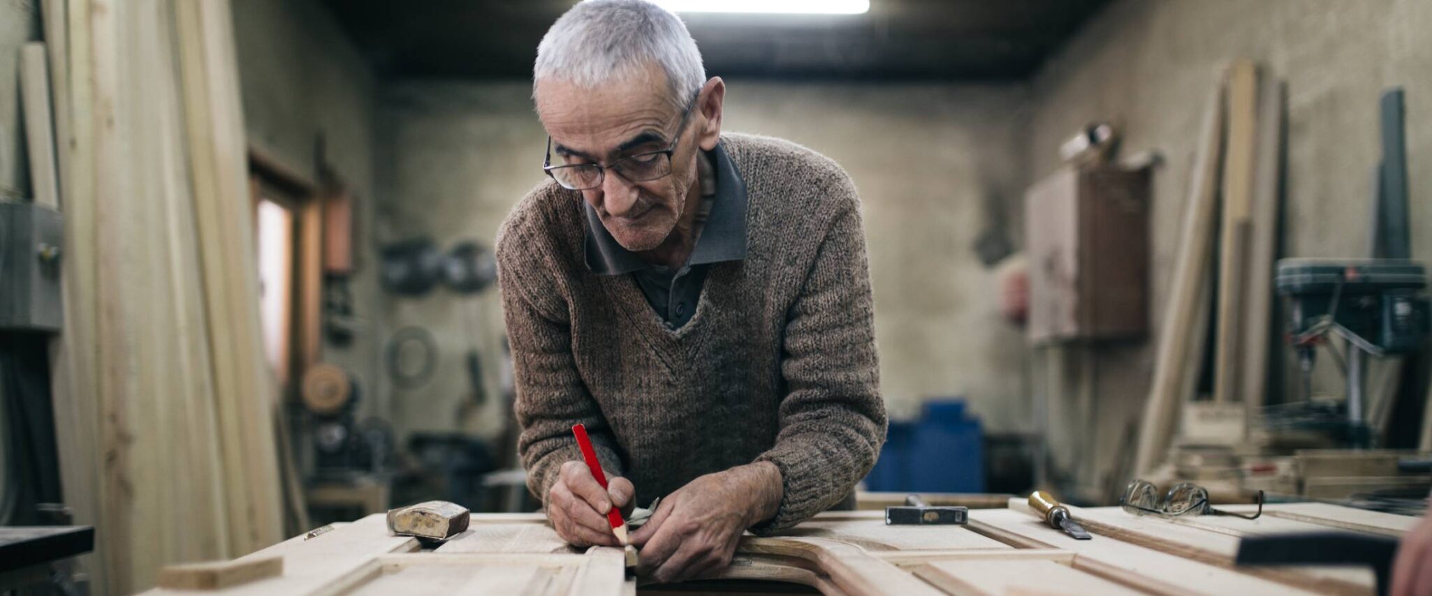 senior man woodworking