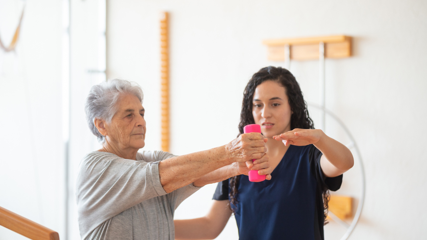 Senior woman receiving therapy from a healthcare worker