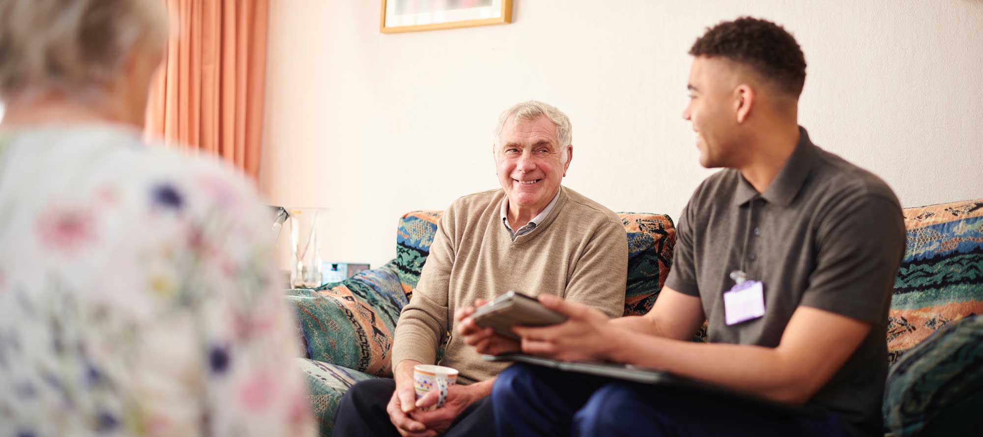 Two men talking in Regency Oaks senior living apartment