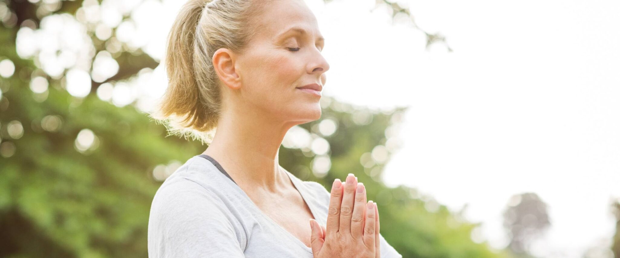 active senior lady in a yoga pose