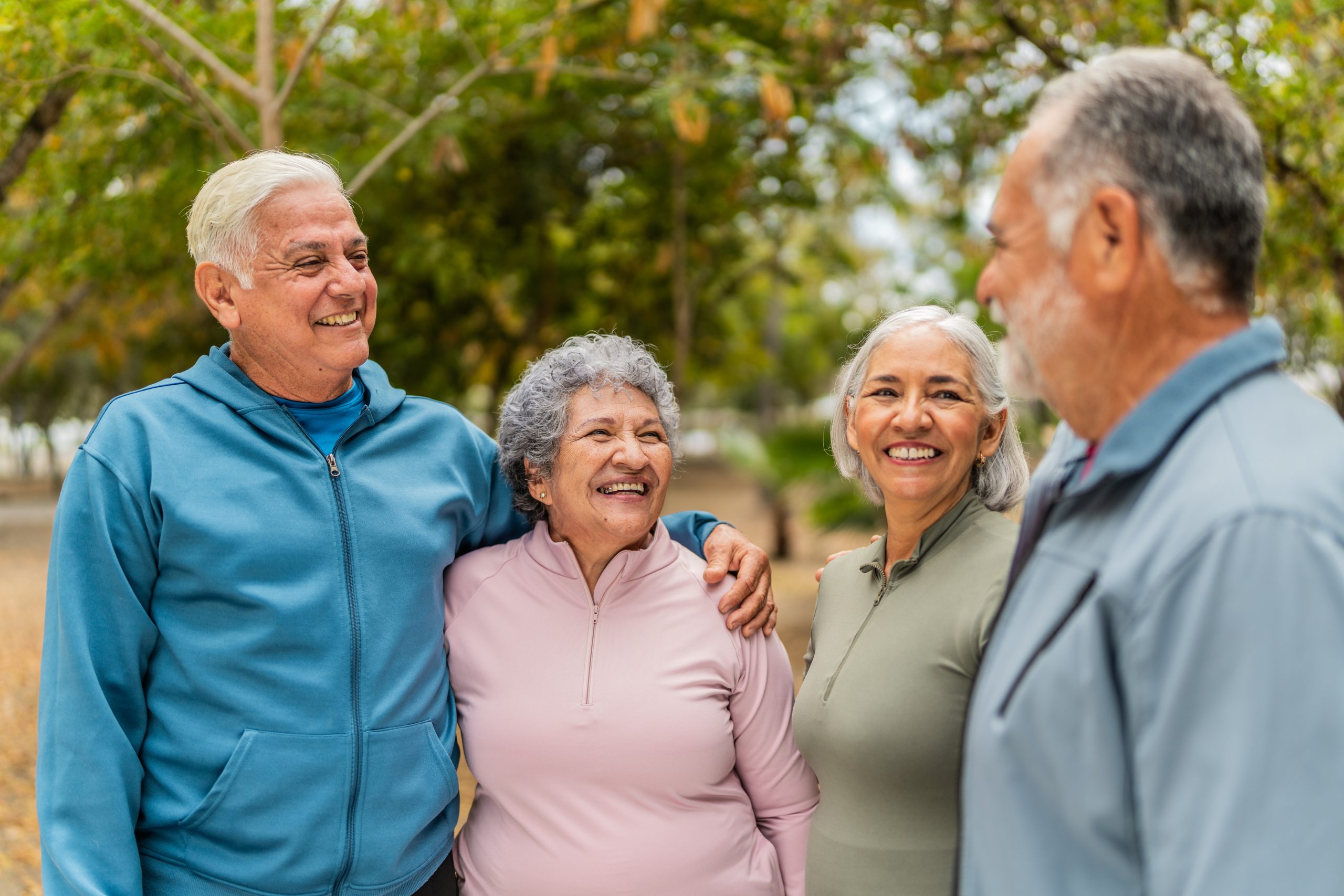 Group of seniors smiling in park